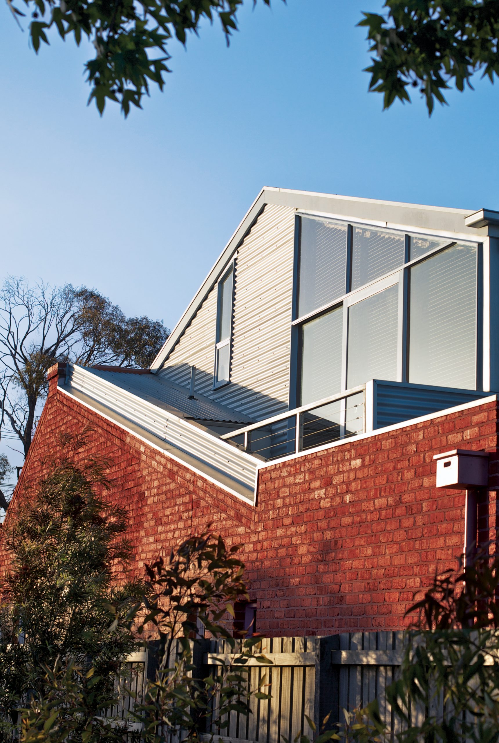 Second storey metal clad addition on top of original house